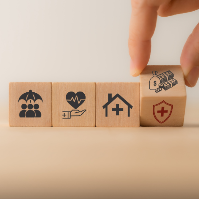 blocks depicting images of different aspects of life: housing, healthcare, connections