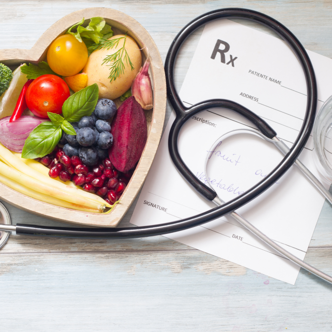 Fruit next to a piece of paper that says Rx and a stethoscope